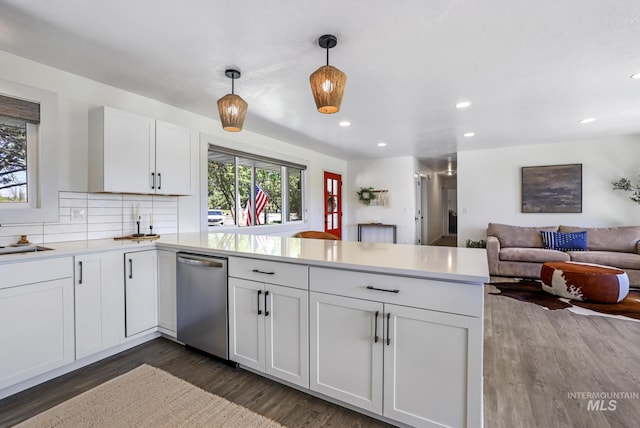 kitchen featuring a peninsula, light countertops, dark wood-style flooring, dishwasher, and recessed lighting