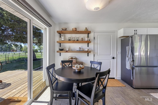 dining room with light wood finished floors