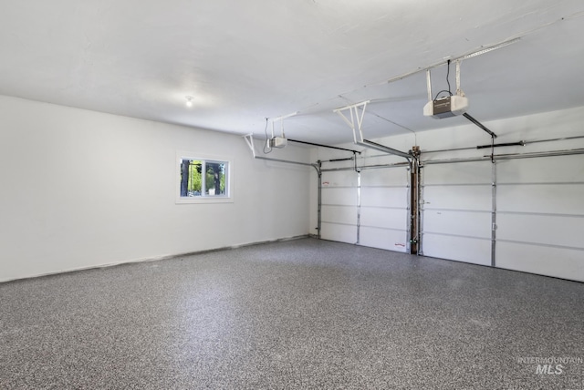 garage featuring baseboards and a garage door opener