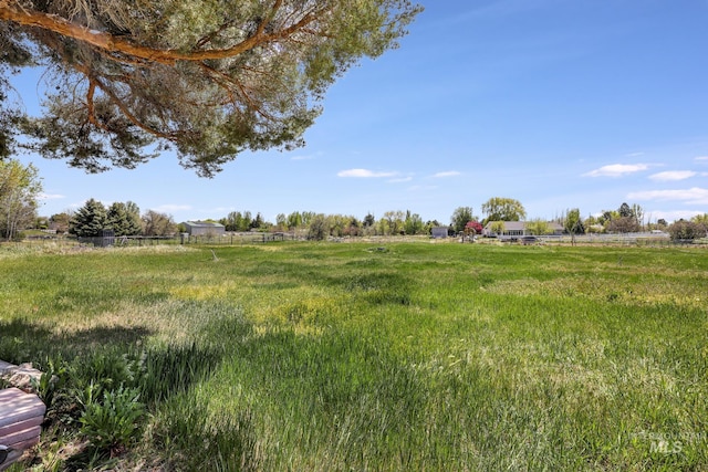 view of yard with a rural view