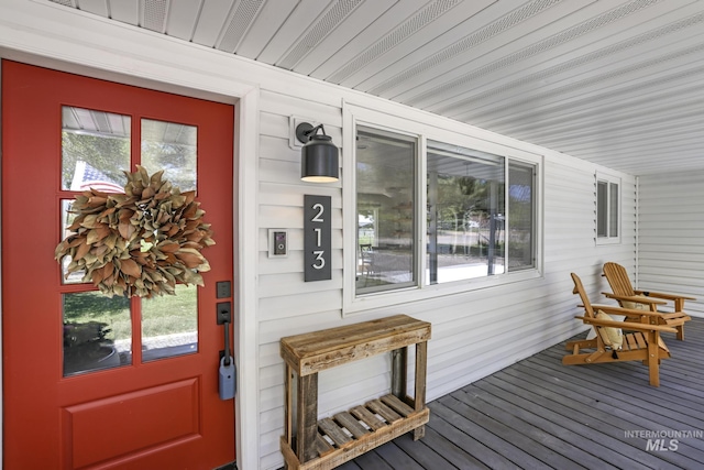 wooden terrace featuring a porch