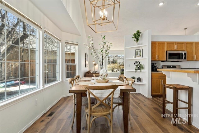 dining room featuring recessed lighting, visible vents, a notable chandelier, and dark wood-style flooring