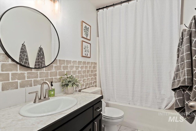 bathroom featuring toilet, shower / tub combo with curtain, and vanity