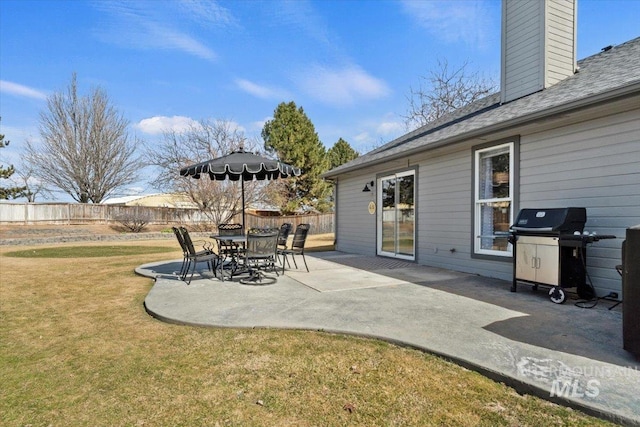 view of patio featuring grilling area and fence