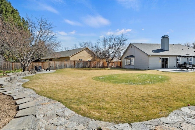 view of yard with a patio and a fenced backyard