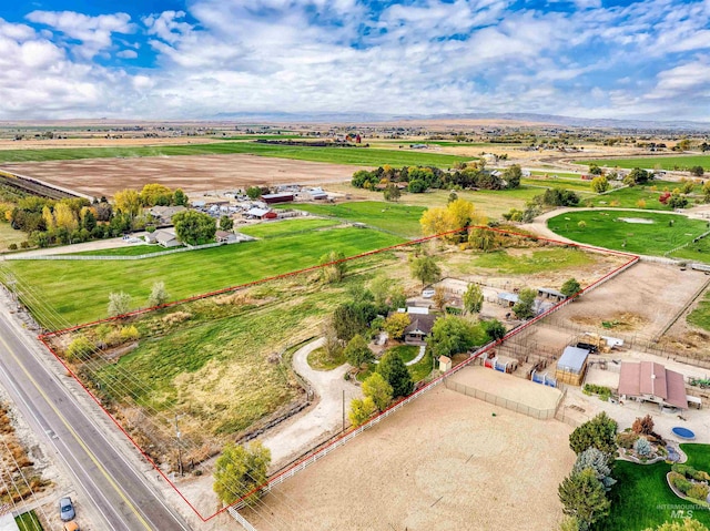 birds eye view of property with a rural view