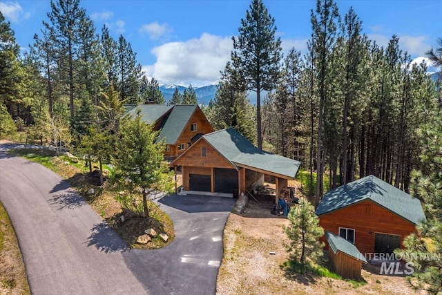 birds eye view of property with a mountain view
