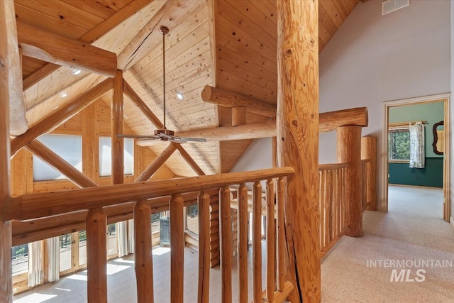 hall featuring high vaulted ceiling, visible vents, wooden ceiling, and beam ceiling