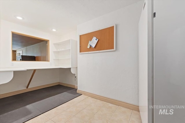 hall with tile patterned flooring, recessed lighting, and baseboards