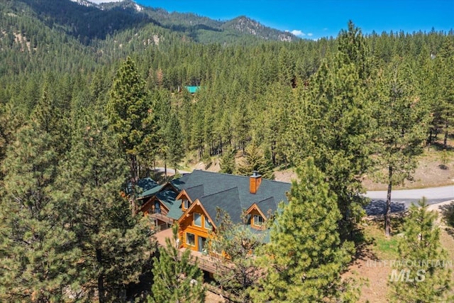 drone / aerial view with a view of trees and a mountain view