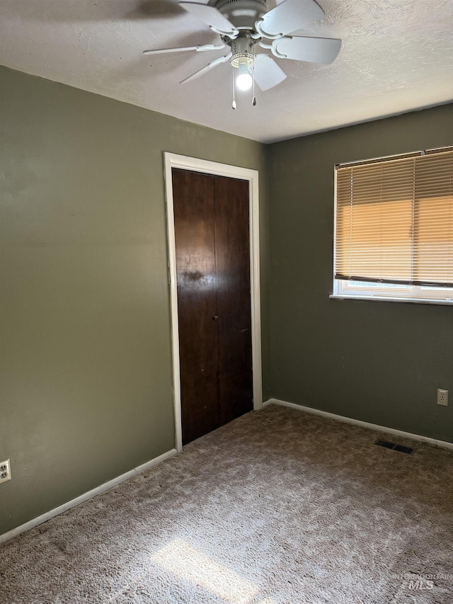 140 Quick Silver Ave, Hagerman, ID 83332 - unfurnished bedroom with carpet, a closet, baseboards, and ceiling fan