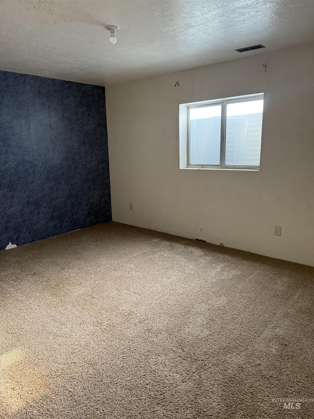 140 Quick Silver Ave, Hagerman, ID 83332 - carpeted spare room with a textured ceiling