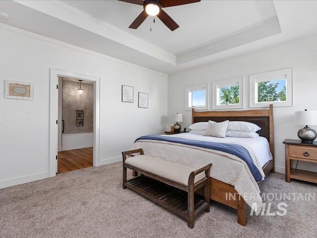 138 Williams Way, Jerome, ID 83338 - bedroom featuring light carpet, a tray ceiling, ensuite bath, and ceiling fan