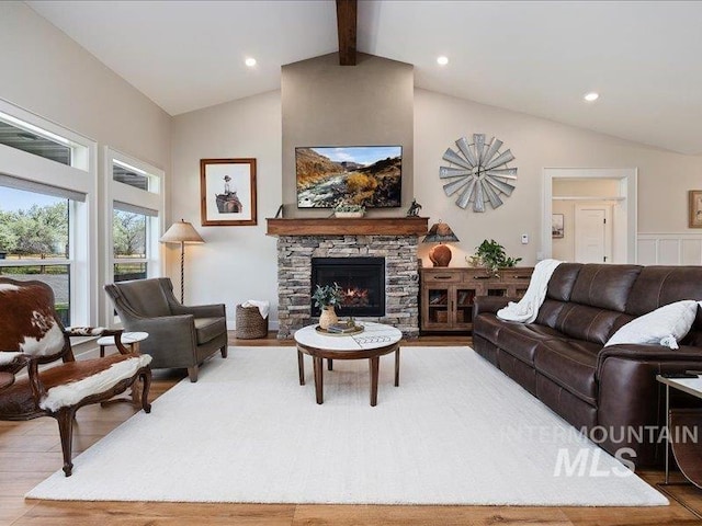 138 Williams Way, Jerome, ID 83338 - living room featuring wood finished floors, beamed ceiling, a stone fireplace, high vaulted ceiling, and recessed lighting
