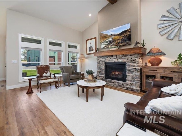 138 Williams Way, Jerome, ID 83338 - living area with high vaulted ceiling, wood finished floors, a fireplace, and recessed lighting