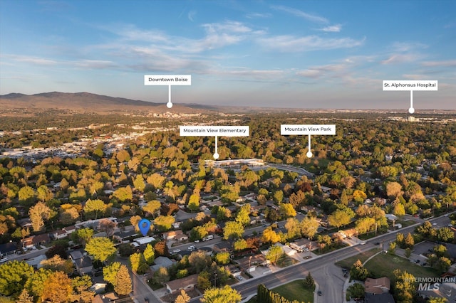 aerial overview of property's location featuring a mountainous background