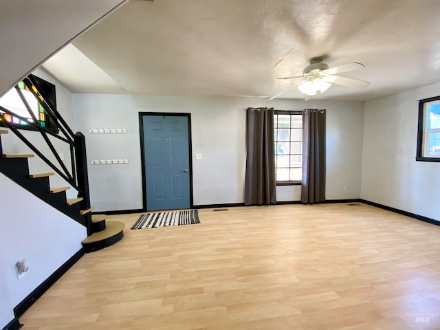 foyer entrance featuring ceiling fan and light hardwood / wood-style floors