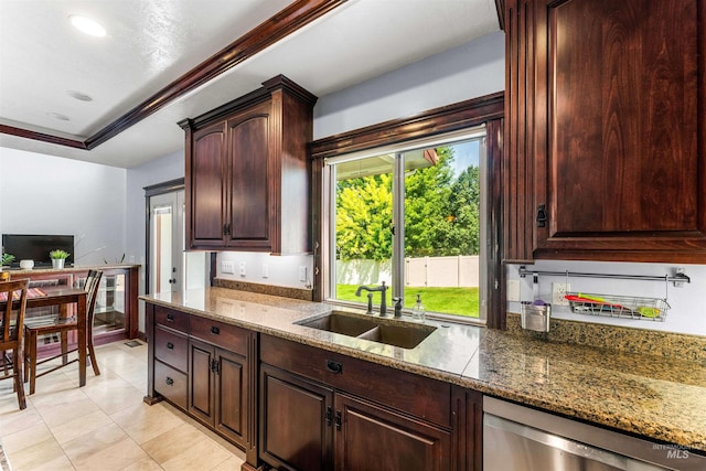 kitchen featuring dishwasher, stone countertops, a raised ceiling, and a sink