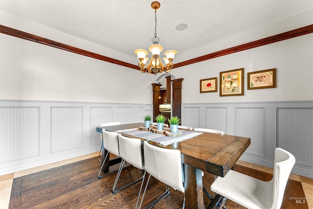 dining room with an inviting chandelier and wood finished floors