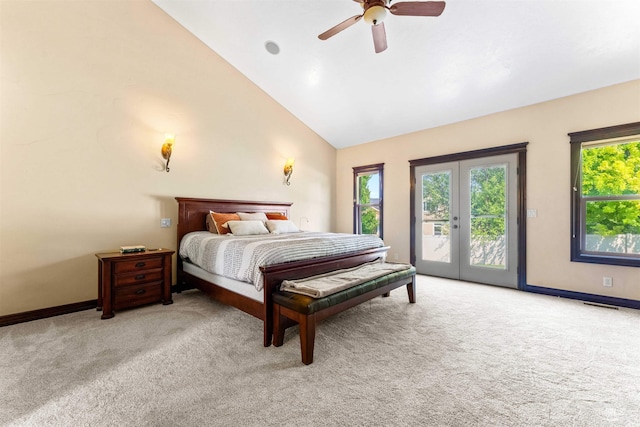 bedroom with access to outside, multiple windows, french doors, and light carpet