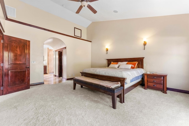 bedroom featuring baseboards, visible vents, high vaulted ceiling, arched walkways, and light colored carpet