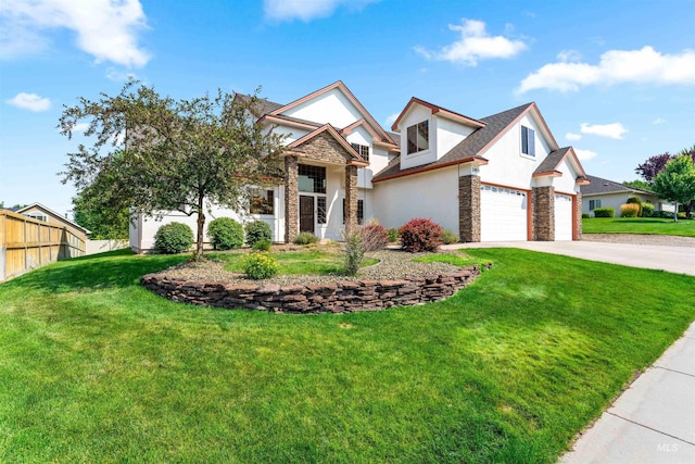 view of front of house with a front lawn, fence, concrete driveway, stucco siding, and stone siding