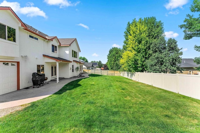 view of yard featuring a patio and a fenced backyard
