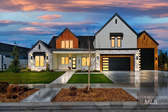 view of front facade with a lawn and a garage