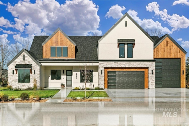 view of front of home with a front lawn and a garage