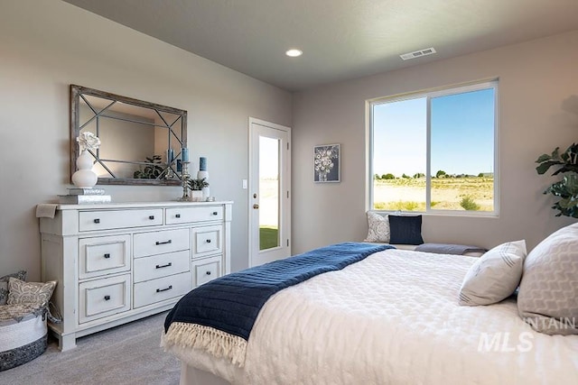 bedroom with light colored carpet, visible vents, and recessed lighting