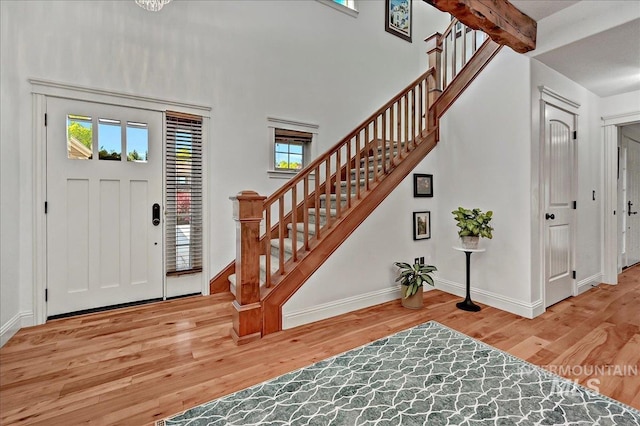 178 Cottonwood Ct, Eagle, ID 83616 - entryway featuring stairs, baseboards, plenty of natural light, and wood finished floors