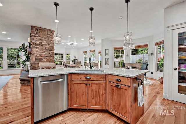 178 Cottonwood Ct, Eagle, ID 83616 - kitchen with a sink, open floor plan, a healthy amount of sunlight, and dishwasher
