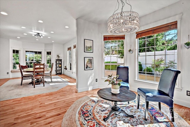 178 Cottonwood Ct, Eagle, ID 83616 - living area with light wood-type flooring, an inviting chandelier, plenty of natural light, and recessed lighting