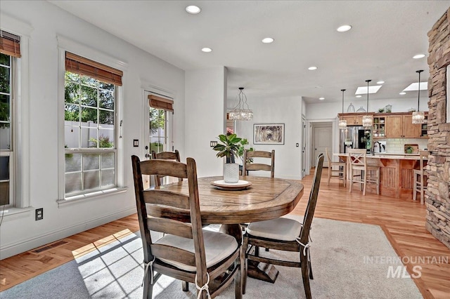 178 Cottonwood Ct, Eagle, ID 83616 - dining room featuring light wood-style flooring, baseboards, visible vents, and recessed lighting