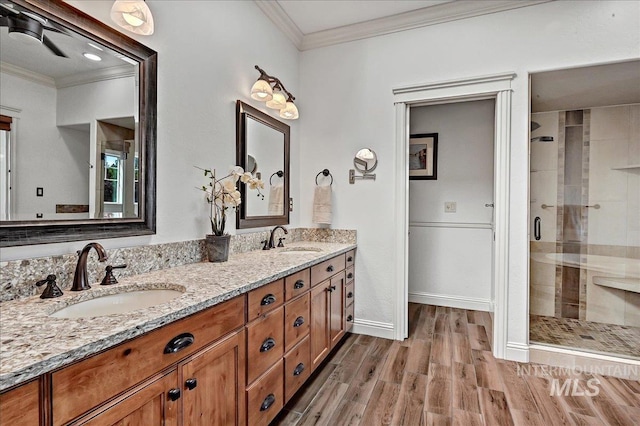 178 Cottonwood Ct, Eagle, ID 83616 - full bath featuring a sink, ornamental molding, a shower stall, and wood finished floors