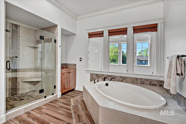 178 Cottonwood Ct, Eagle, ID 83616 - full bath with a stall shower, baseboards, a garden tub, vanity, and crown molding