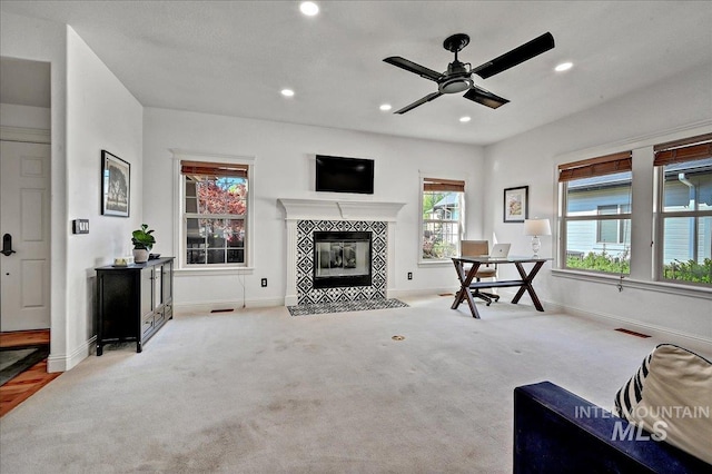 178 Cottonwood Ct, Eagle, ID 83616 - carpeted living room featuring a ceiling fan, a fireplace, visible vents, baseboards, and recessed lighting