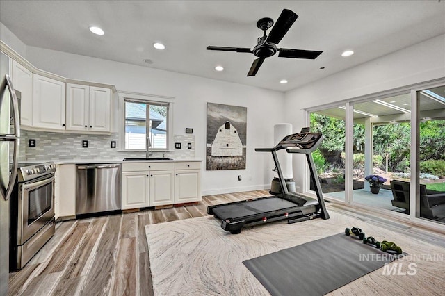 178 Cottonwood Ct, Eagle, ID 83616 - exercise area featuring light wood-style flooring, a sink, baseboards, ceiling fan, and recessed lighting