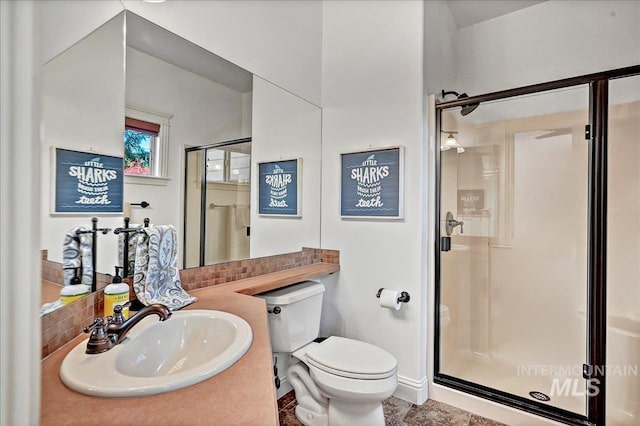 178 Cottonwood Ct, Eagle, ID 83616 - bathroom featuring vanity, toilet, and a shower stall