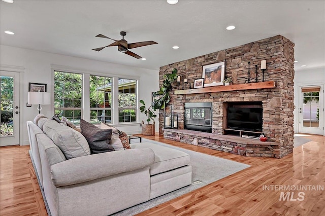 178 Cottonwood Ct, Eagle, ID 83616 - living area with wood finished floors, a fireplace, ceiling fan, and recessed lighting