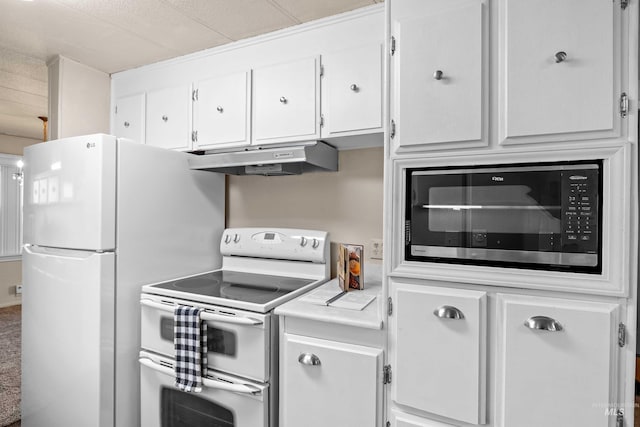 kitchen featuring white cabinetry and white appliances