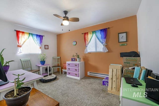 carpeted office featuring baseboard heating and a ceiling fan