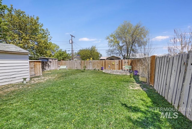 view of yard with a fenced backyard