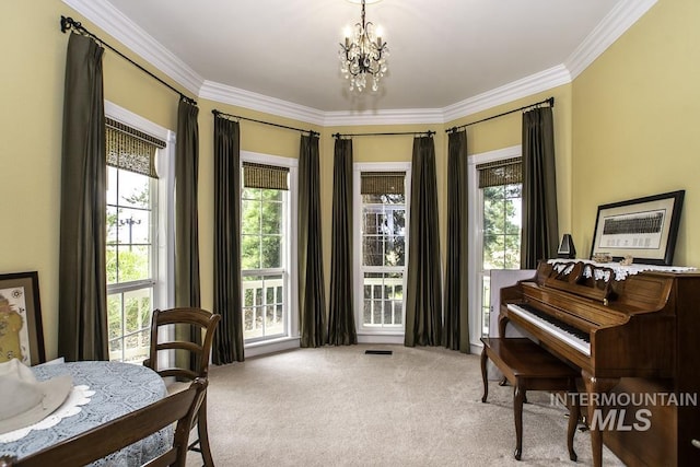 living area with plenty of natural light, a notable chandelier, crown molding, and carpet floors