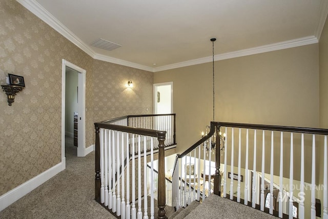 stairway with ornamental molding, baseboards, carpet, and visible vents