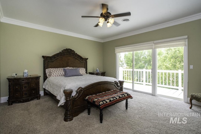carpeted bedroom with access to outside, crown molding, and visible vents