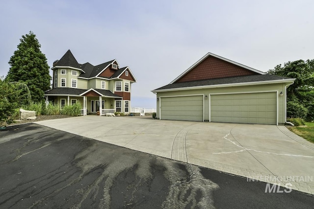 view of front of house featuring concrete driveway and a garage
