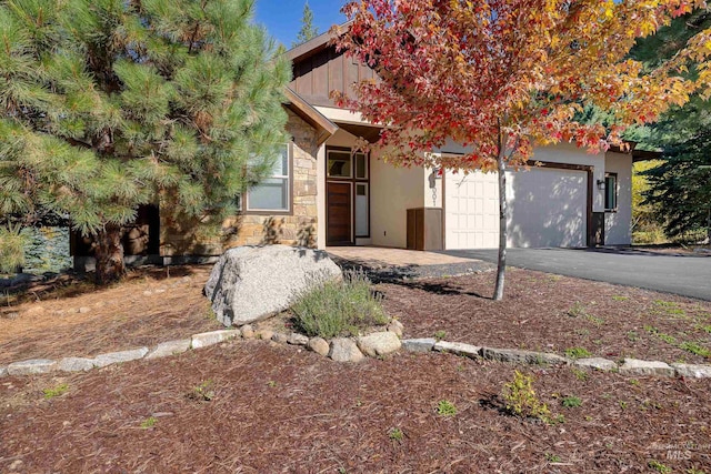 obstructed view of property with a garage