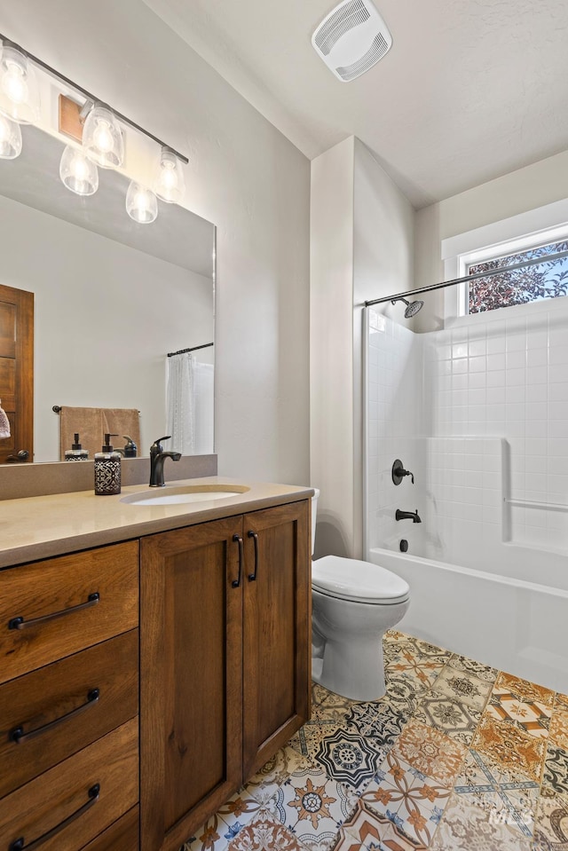 full bathroom with shower / bathtub combination with curtain, tile patterned flooring, vanity, and toilet