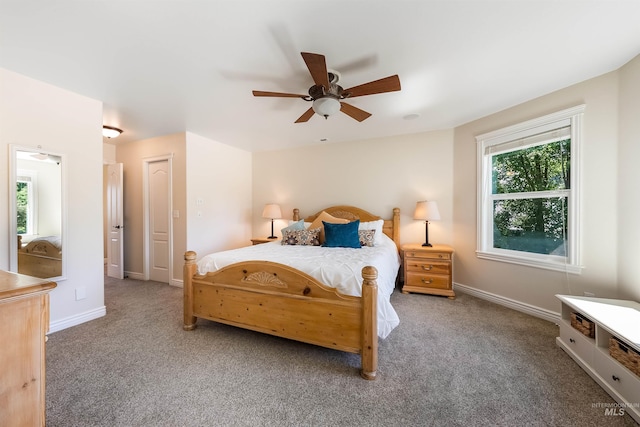 bedroom featuring carpet floors, baseboards, and a ceiling fan